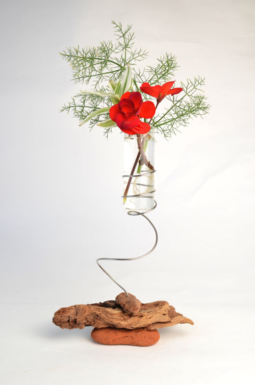 Dotterel (large) vase with flower and foliage on sea-sculpted bricks and driftwood